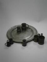 An 18th/19thC pewter charger and pewter and other measures.