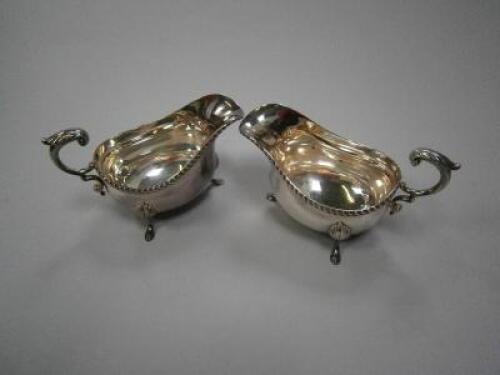 A pair of modern silver sauce boats