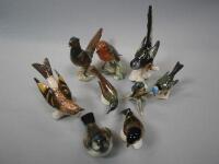 A collection of eight Goebel figures of birds and another.