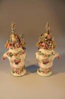 A pair of Longton Hall rococo moulded vases with covers circa 1755