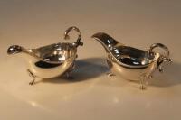 A pair of Elizabeth II Georgian style silver sauce boats