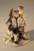 A 19thC porcelain figure group of two young lovers