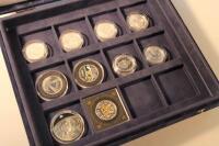 Six silver half ounce one pound coins and four other commemorative coins