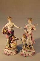 A pair of German porcelain figures of ladies