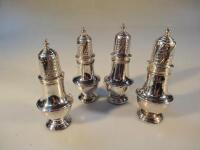 A set of four Victorian silver pepperettes