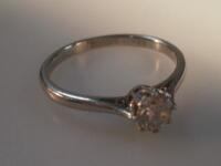 A diamond solitaire ring