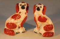 A pair of Staffordshire flat back spaniels