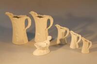 Five Royal Worcester graduated jugs