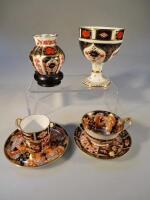 Two Royal Crown Derby cabinet cups and saucers