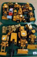 A collection of die-cast diggers