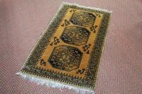 A small yellow ground Persian rug