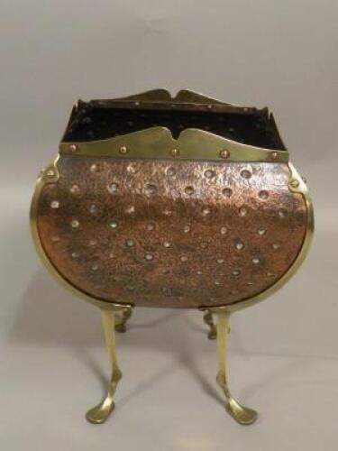An Art Nouveau style copper and brass coal bucket