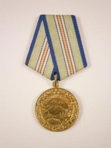 A Russian gilt metal medal