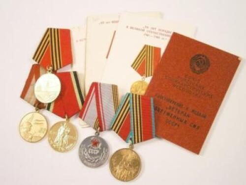 Various medals and papers to include