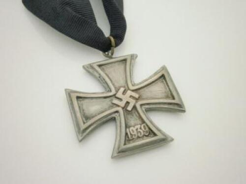 A replica Third Reich iron cross