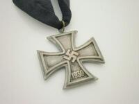 A replica Third Reich iron cross