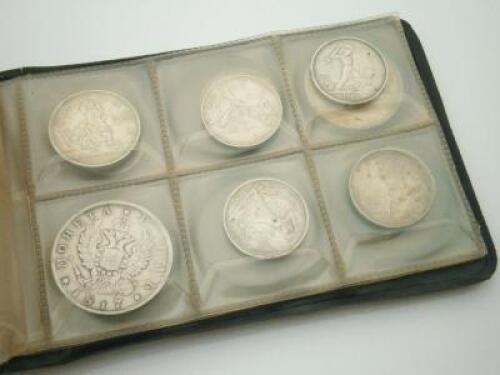 A collection of Continental white metal coins