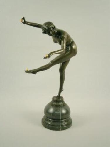 A reproduction Art Deco style bronze figure of a nude female juggler
