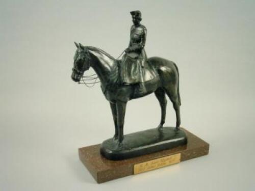 A bronzed resin figure of Queen Elizabeth II on horseback