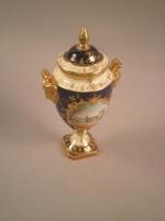 A Coalport porcelain two handled vase and cover