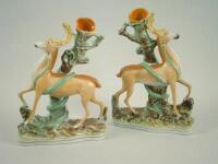 A pair of 19thC Staffordshire flat back spill vases