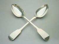 A pair George IV of silver Fiddle pattern dessert spoons