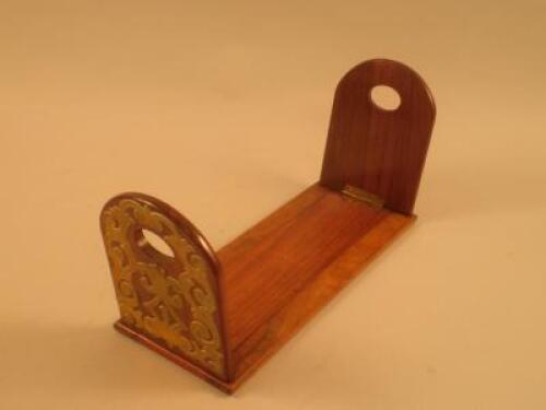 A Victorian walnut and brass adjustable book stand