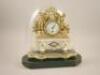 A 19thC French gilt metal and alabaster figural mantel timepiece