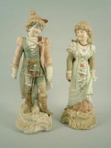 A near pair of late 19thC German bisque porcelain figures