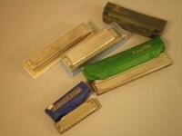 Five Hohner harmonicas