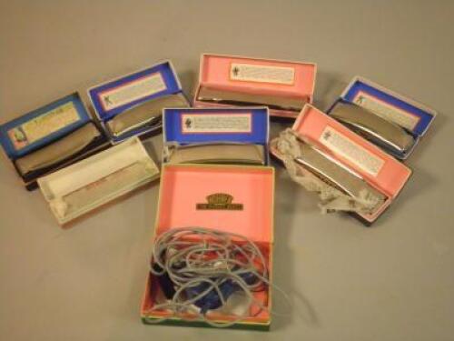 Six Hohner harmonicas