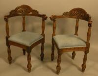 A pair of early 20thC oak corner chairs