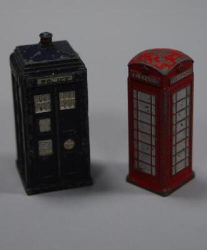 A die-cast toy police telephone box and a telephone box.