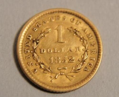 An American gold one dollar