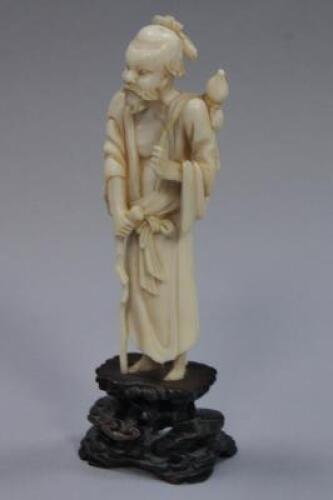 A Chinese carved ivory figure of a sage