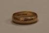 A 9ct gold engraved wedding band