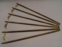 Twelve brass stair rods with fittings.