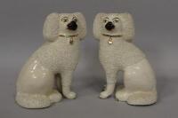 A pair of Staffordshire comforter dogs