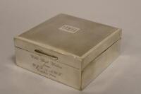 A small silver cigarette box