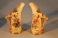 A pair of Royal Worcester porcelain tusk jugs