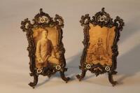 A pair of cast brass cold painted photograph frames