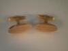 A pair of oval bicolour metal cufflinks stamped 750 and 350