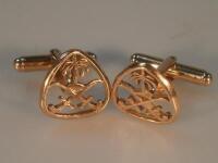 A pair of cufflinks with palm tree and cross sabre motif