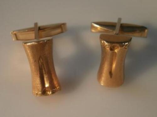 A pair of elephant foot cufflinks in yellow metal