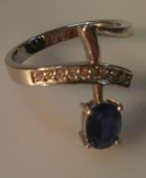 An abstract sapphire and tiny diamond set dress ring