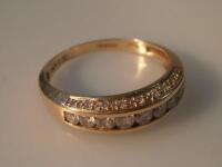 A half hoop channel set diamond eternity ring