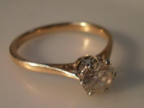 A diamond solitaire ring