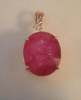 An 18ct gold ruby and diamond pendant