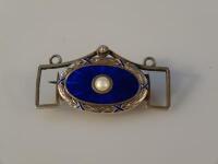 A Scandinavian enamelled white metal brooch by Marius Hammer