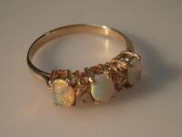 An opal and tiny diamond dress ring